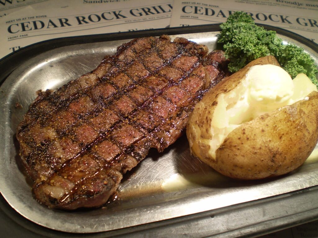 an angus beef ribeye and potatoes meal at Cedar Rock Grill